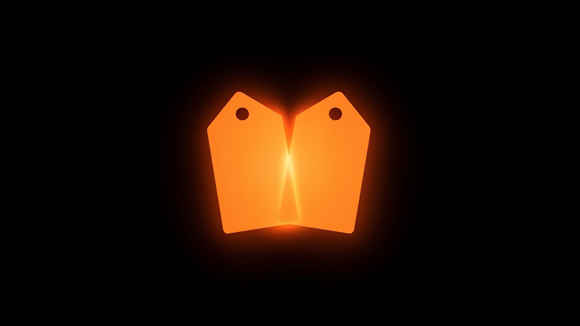 Two identical glowing orange tag silhouettes overlapping at the center with a soft interference glow on a black background